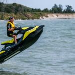 man riding personal watercraft